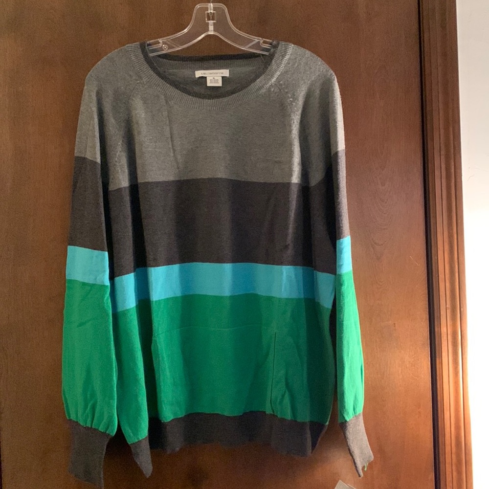 Liz Claiborne colorful sweater with hand warmer pocket. New with tags. Stylish